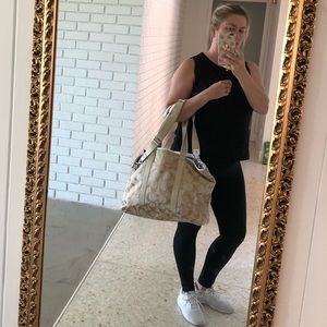 Coach duffle bag with shoulder strap.